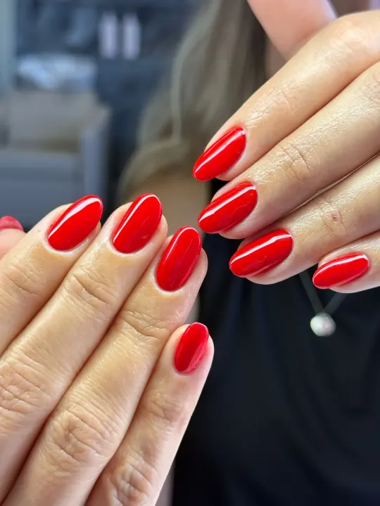 Bright red gel manicure at Bliss & Blade
