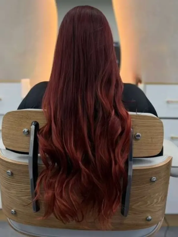 Long red hair styled at the salon