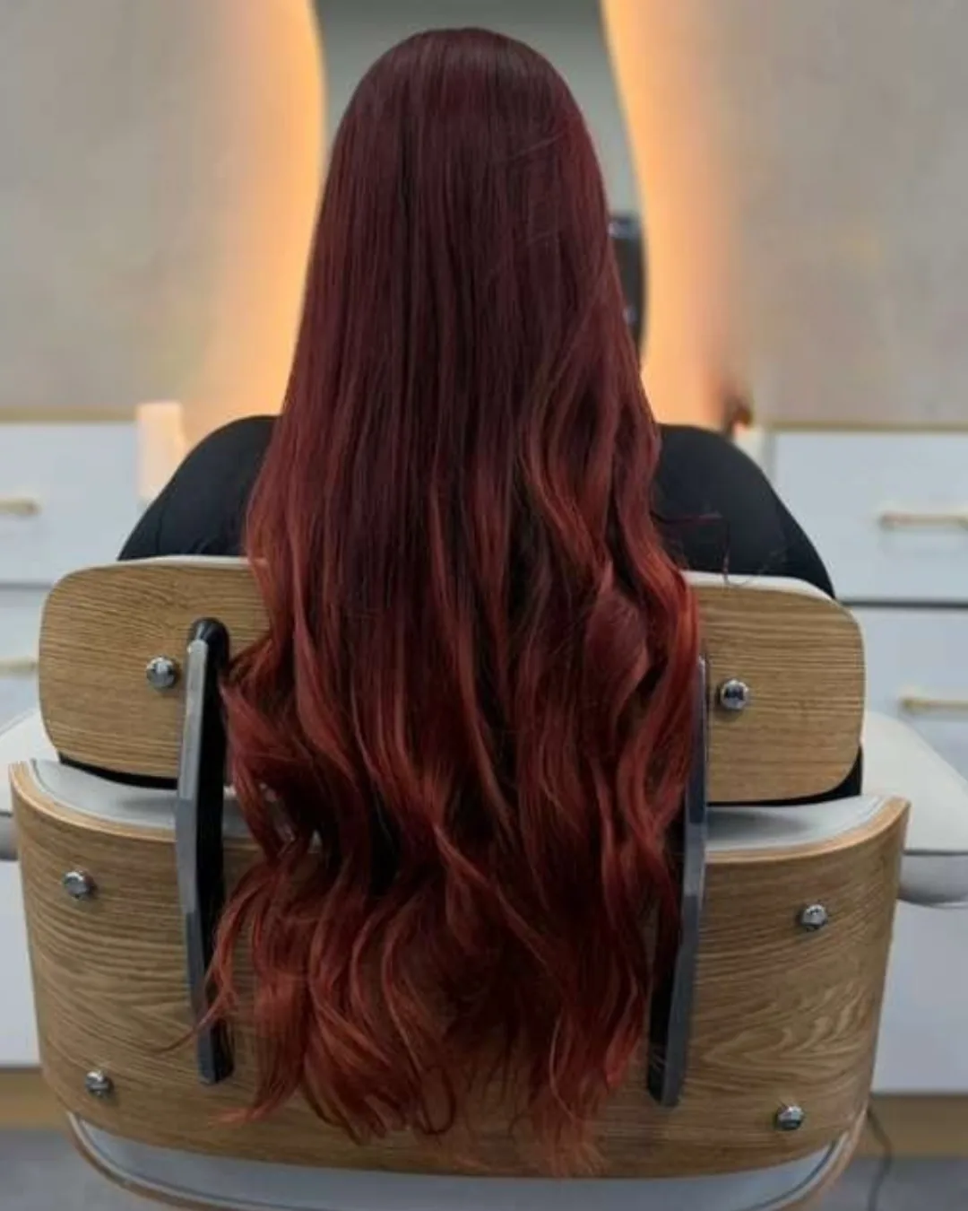 Long red hair photographed from behind at Bliss & Blade