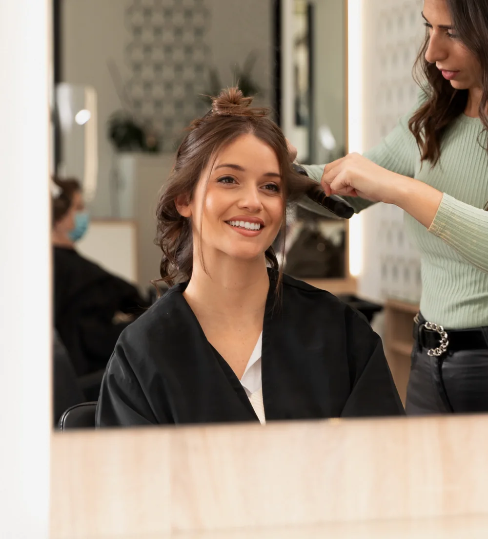 Women's hair styling at Bliss & Blade in Foster City